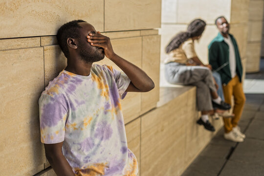 Young African American frustrated and upset outdoors urban building