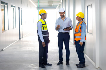 Group Ethnic diversity engineering team worker people, Success teamwork. Group of professional engineering people wearing hardhat safety helmet meeting discussion in new project at warehouse factory