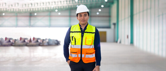 Portrait Asian male. Warehouse staff Employees worker standing by goods shelf working in large...