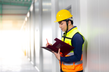 Portrait Asian male. Warehouse staff Employees worker standing by goods shelf working in large...