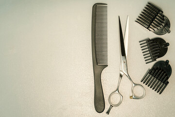 Hair cutting tools neatly arranged on barber's table in modern salon