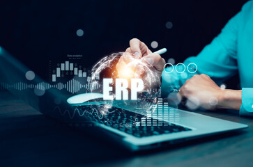 Business people using a laptop with document management for ERP. Enterprise resource planning concept,Enterprise Resource Management ERP software system for business resources plan presented.