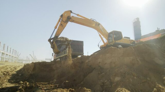 Excavator is digging at construction site