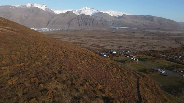 Scenic aerial footage of a mountain and valley in Iceland.