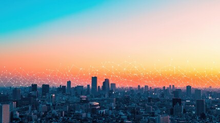 Fototapeta premium A stunning sunset over a city skyline, blending shades of blue and orange, with a vibrant atmosphere and distant buildings silhouetted against the colorful sky.