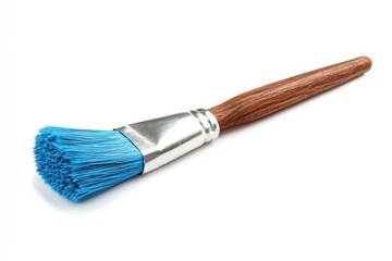 Fototapeta premium A wooden handled paintbrush with vibrant blue bristles and a metallic ferrule securing the bristles