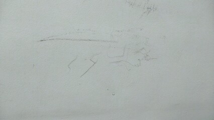a very faint and unclear pencil sketch on a white surface. The drawing appears to be incomplete or...