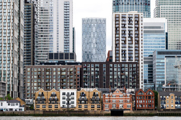 A captivating mix of diverse architectural styles seen in an urban setting, showcasing the integration of old and new buildings next to modern skyscrapers in London UK