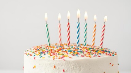 Birthday cake with colorful sprinkles and ten candles, confectionery