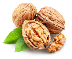 Whole walnuts, broken walnut with kernel and green leaves isolated on white background. Clipping path.