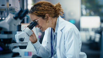 Medical Research and Development Laboratory: Beautiful Hispanic Female Scientist Working on a...