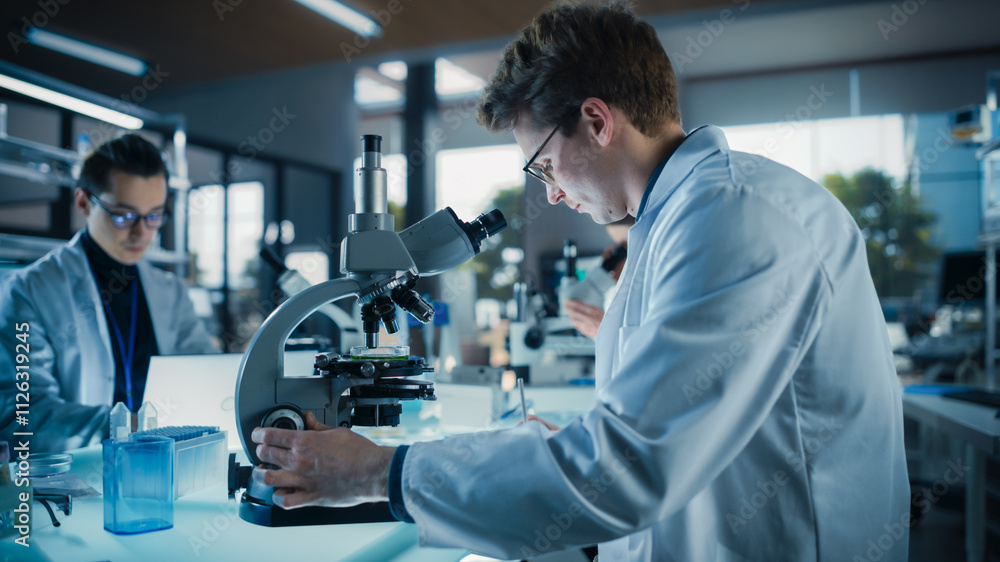 Poster portrait of a handsome caucasian student working on a research project in university. medical resear