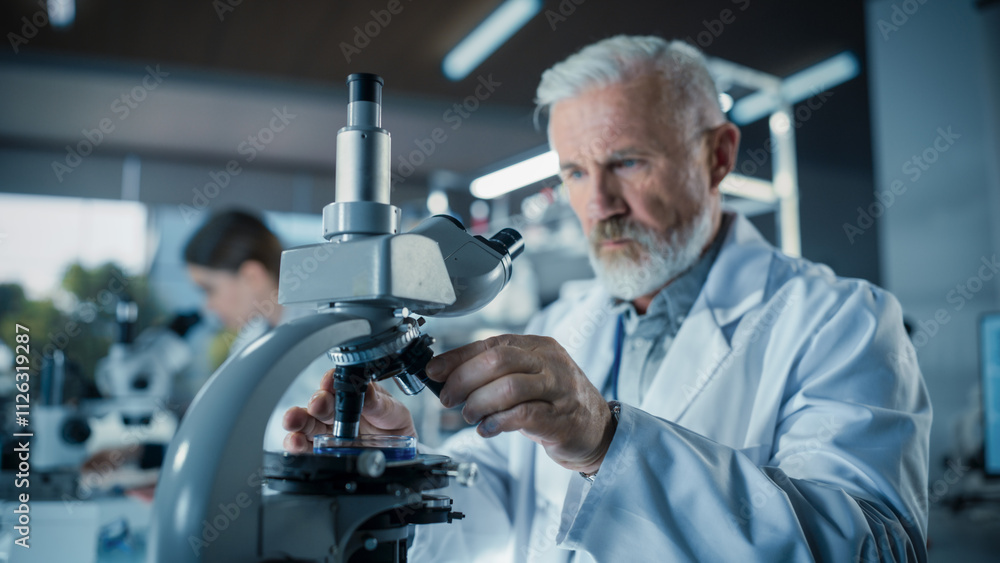Poster medical research and development laboratory: middle aged head scientist working on research project,