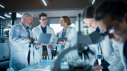 PhD Professor Teaching a Group of Science Students the Basics of Gene Therapy and Biological...