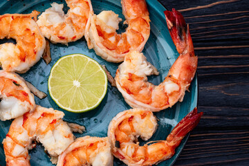 Grilled Tiger shrimps with lime photography . Top view
