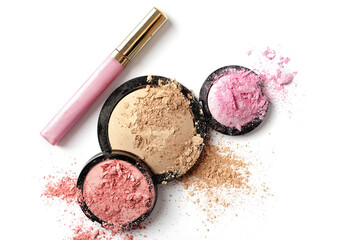 Make-up crushed eyeshadow, face compact powder and lipgloss isolated on white background - for...