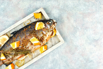 Roasted trout on a plate.