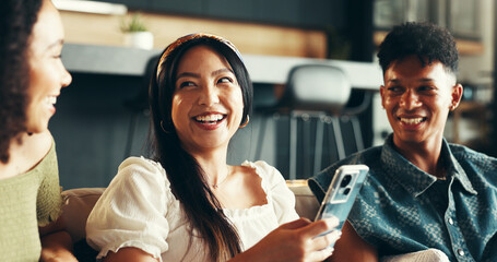 House, smartphone and friends on sofa, typing and funny with weekend break, smile and relax. People, apartment and women with man, cellphone and humor with happiness, comfort and bonding together