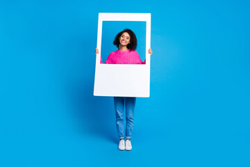 Full body photo of attractive young woman hold instant photo frame dressed stylish pink clothes...