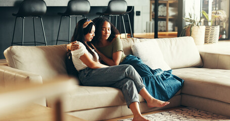 House, comfort and women on sofa, hug and sad with emotion, support and relax. People, apartment...