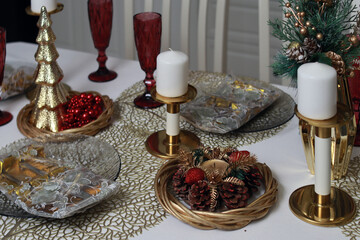 Beautifully served New Year's table. Candles, cutlery. Christmas. Close-up. Copyspace