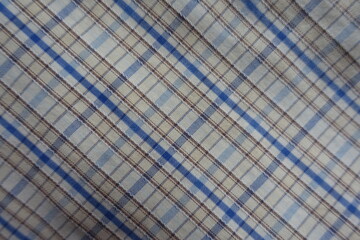 white, blue and brown checkered cotton fabric from above