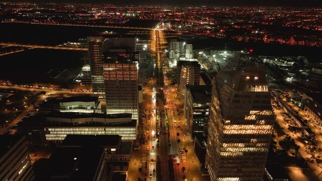 Nighttime drone view of a new boulevard at CFC with vibrant car lights and modern architecture. This 4K footage highlights Morocco&rsquo;s dynamic nightlife and urban innovation.