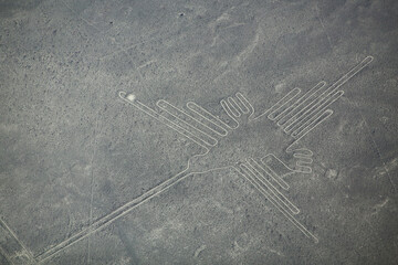Aerial view of Nazca Lines - Hummingbird geoglyph, Peru.