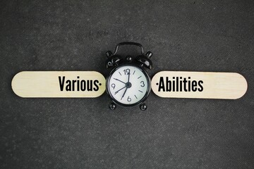 bell clock with words of various abilities. the concept of multiple skills can be done for one person