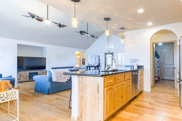 Contemporary open kitchen with wooden accents in a spacious living area designed for comfort and relaxation