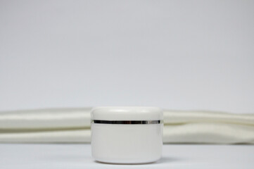 White cosmetic jar mockup on white background.