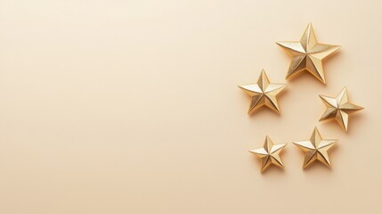 A collection of golden stars arranged on a soft beige background, creating a festive and elegant atmosphere.