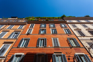 Typical Roman Houses Along Frattina Street Under a Clear Blue Sky