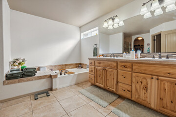 Relaxing contemporary bathroom with natural light and wooden accents creating a calming atmosphere