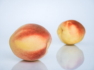 White Swan Peaches Isolated on White Background with Reflection