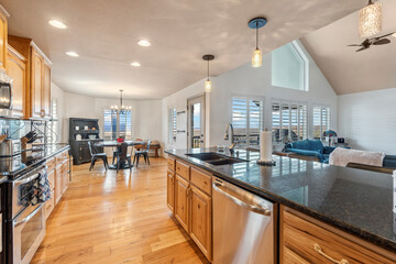 Spacious modern kitchen with open dining area and natural light in a cozy home setting