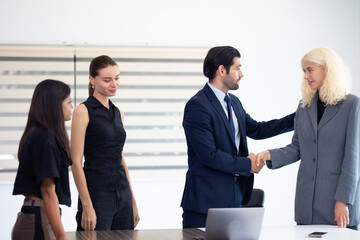 Business meeting -  Group of friends meeting at home. Diverse business people asian woman and caucasian man discussion in corporate meeting at conference room