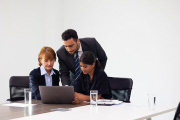 Business meeting -  Group of friends meeting at home. Diverse business people asian woman and caucasian man discussion in corporate meeting at conference room