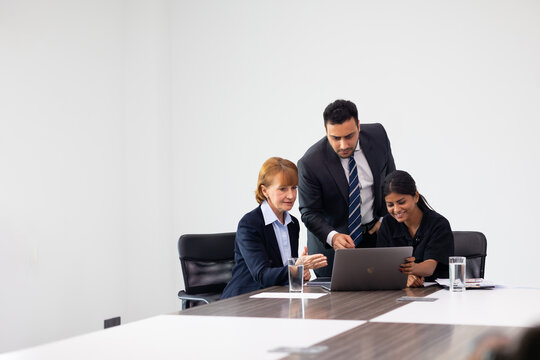 Business meeting -  Group of friends meeting at home. Diverse business people asian woman and caucasian man discussion in corporate meeting at conference room