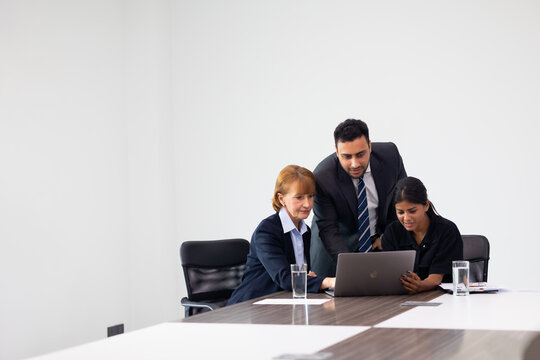 Business meeting -  Group of friends meeting at home. Diverse business people asian woman and caucasian man discussion in corporate meeting at conference room