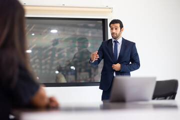 Businesspeople Meeting In Modern Boardroom. Hispanic businessman with team coworkers business discussion in meeting boardroom coworking. Teamwork