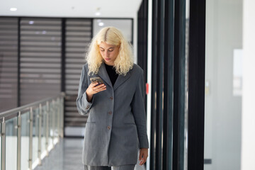Obraz premium Caucasian People talking conversation with mobile phone. Portrait of smiling business woman. Confident successful business female people wear casual classic jacket woking in office