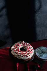 Delicious ready to eat wreath Christmas cake decorated with fresh cranberries and cream cheese frosting with festive styling