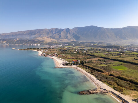 Aerial drone view of the coastline and beach in Orikum, Albania.