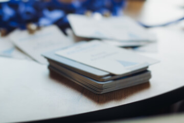 Process of checking in on conference congress forum event, registration desk table, visitors and attendees receiving lanyard with name badge and entry wristband bracelet and register electronic ticket