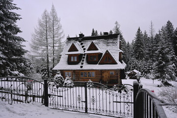 Polish Mountain House in the Snowy Mountains of Zakopane, Tatra Mountains National Park. Polish Chalet Architecture in a Winter Wonderland