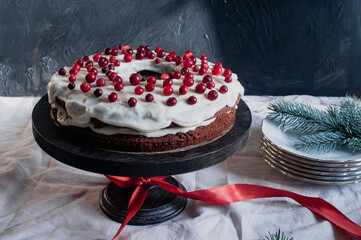 Delicious ready to eat wreath Christmas cake decorated with fresh cranberries and cream cheese frosting with festive styling