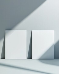 Fototapeta premium Minimalist blank canvas mockup with soft natural light and subtle shadows, ideal for showcasing artwork, branding concepts, and modern, elegant graphic design presentations.