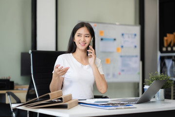Business woman talk mobile phones and working on laptop computers, online business.