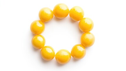 Yellow melon beads arranged in a circular pattern on a clean white background showcasing vibrant color and geometric design